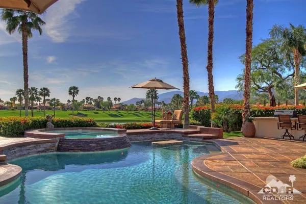 a view of a park with palm trees