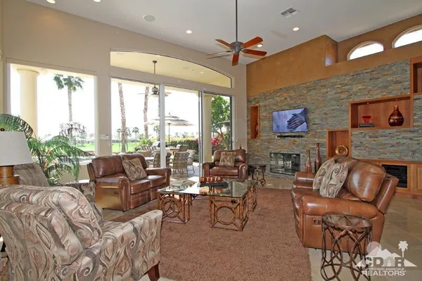 a large kitchen with a large counter top appliances and cabinets