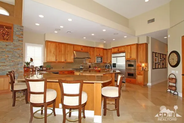 a kitchen with counter top space a sink and cabinets