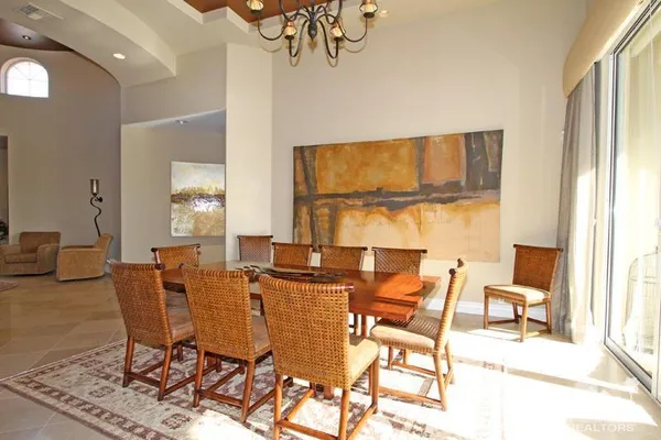 a bed room with a bed and a large window