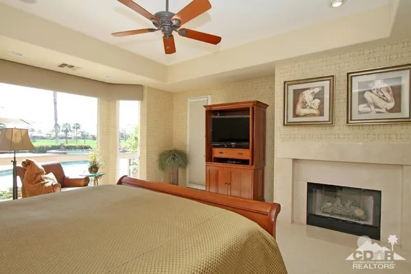 a bedroom with a bed and a couch