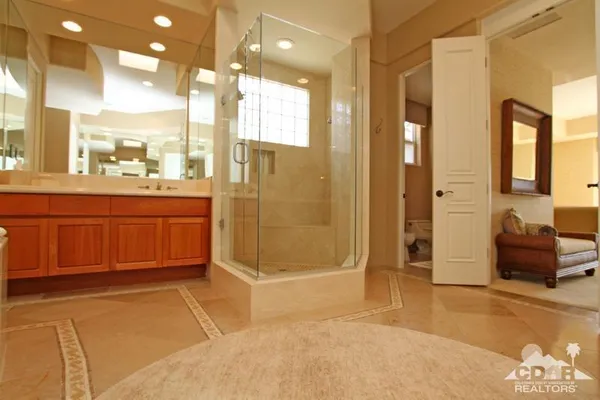 a bedroom with a bed dresser and a window