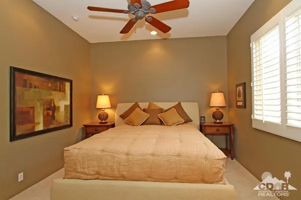 a view of a swimming pool with a table and chairs
