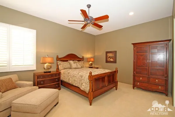 a view of a house with backyard sitting area and garden