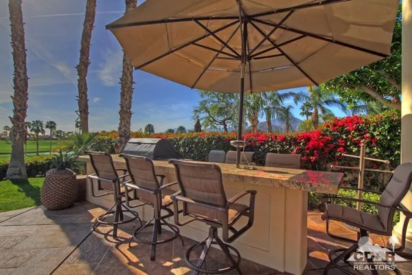 a view of a house with a flower garden