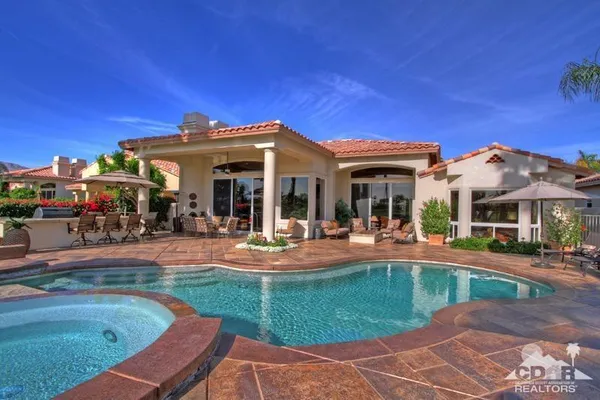 a view of a golf course with a lake
