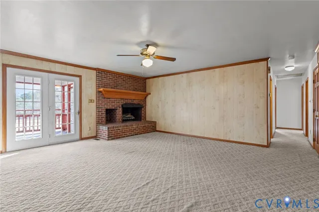 a spacious bathroom with a toilet a sink and a mirror