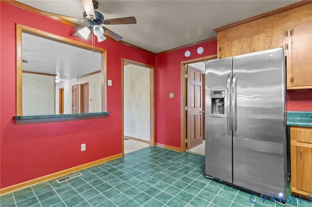a bathroom with a sink a toilet and shower curtain