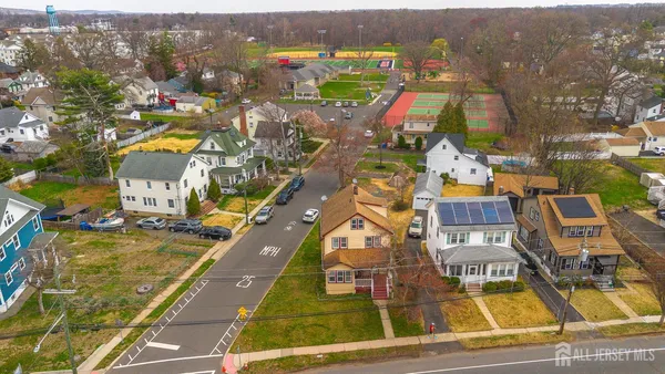 an aerial view of residential houses with outdoor space