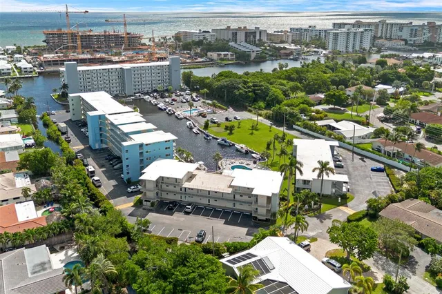 an aerial view of a house with a yard lake view