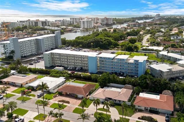 an aerial view of residential houses and city street