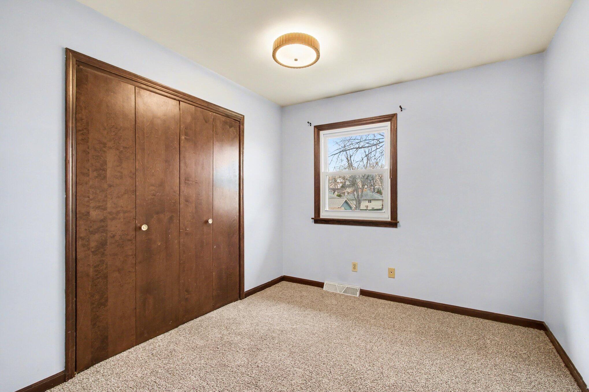 1379 Leeward Road Crown Point, IN 46307 - Photo 17 of 39 a view of an empty room with a chandelier fan