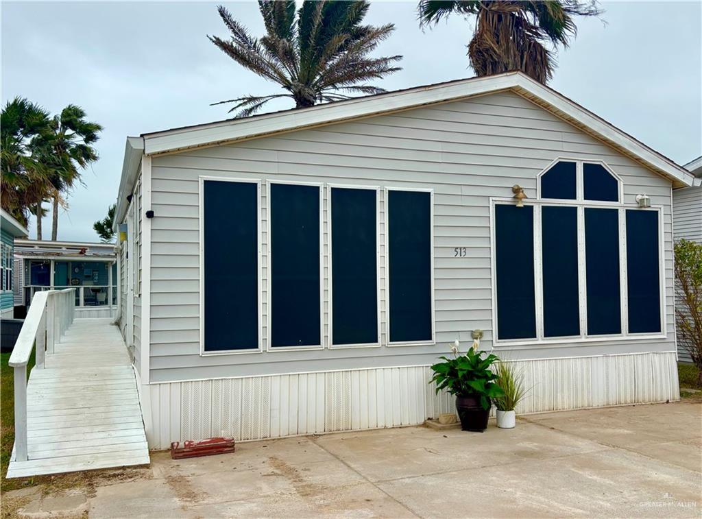 513 West Clam Circle Port Isabel, TX 78578 - Photo 1 of 37 a view of a house with a garden