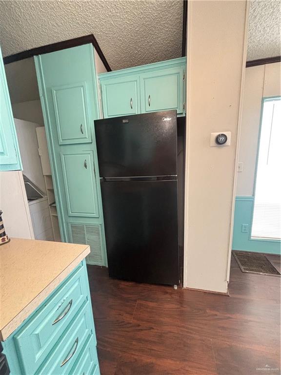513 West Clam Circle Port Isabel, TX 78578 - Photo 13 of 37 a kitchen with a refrigerator and a stove