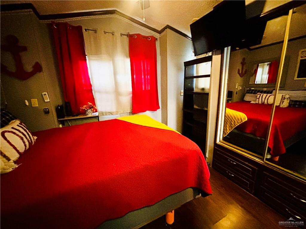 513 West Clam Circle Port Isabel, TX 78578 - Photo 15 of 37 a bed room with a bed and a window
