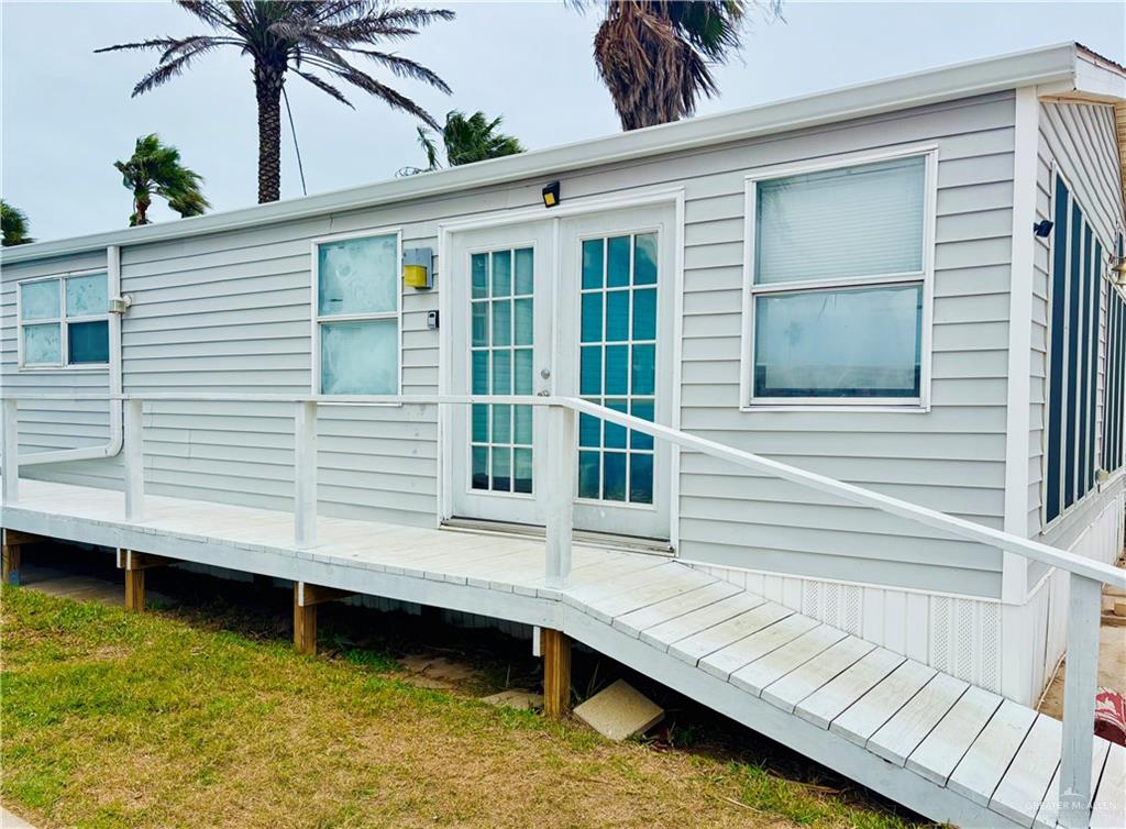 513 West Clam Circle Port Isabel, TX 78578 - Photo 3 of 37 a view of a house with a swimming pool