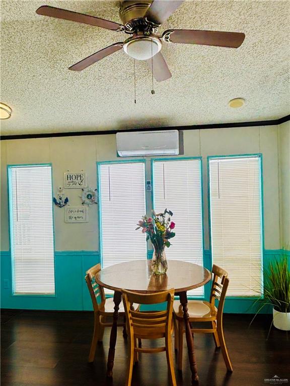 513 West Clam Circle Port Isabel, TX 78578 - Photo 9 of 37 a view of a dining room with furniture and wooden floor