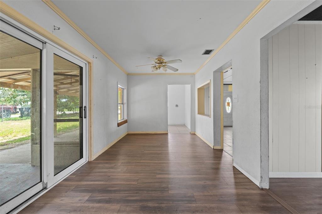 330 West 4th Street Frostproof, FL 33843 - Photo 11 of 39 wooden floor in an empty room with a window