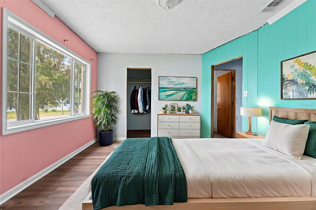 330 West 4th Street Frostproof, FL 33843 - Photo 16 of 39 a spacious bedroom with a bed and a large window