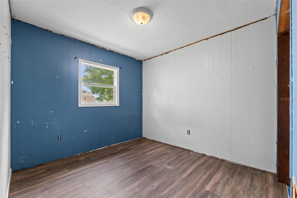 330 West 4th Street Frostproof, FL 33843 - Photo 18 of 39 a view of empty room with wooden floor