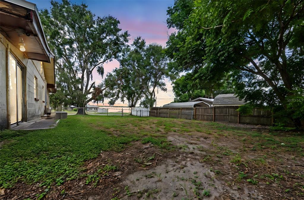 330 West 4th Street Frostproof, FL 33843 - Photo 31 of 39 a front view of a house with garden