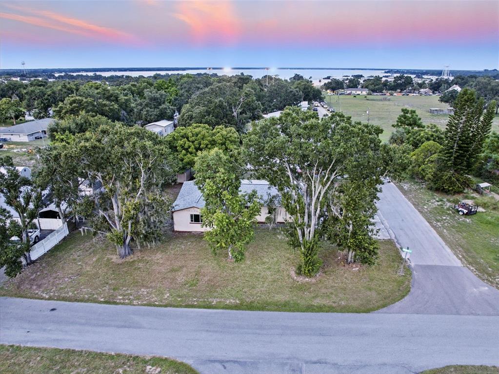 330 West 4th Street Frostproof, FL 33843 - Photo 34 of 39 an aerial view of a house with a yard and lake view