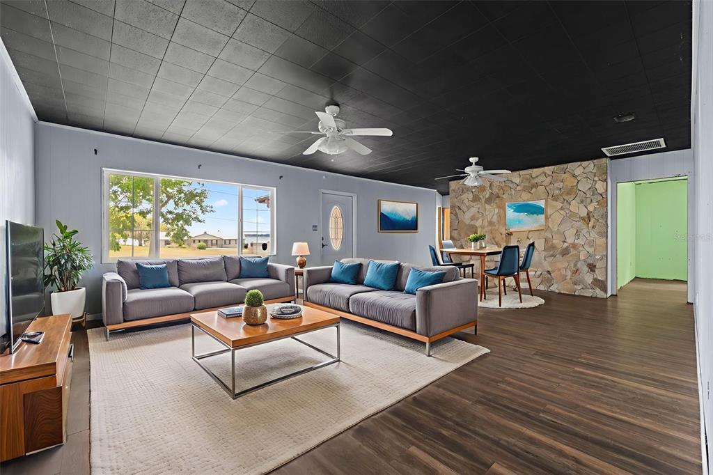 330 West 4th Street Frostproof, FL 33843 - Photo 5 of 39 a living room with furniture and a large window