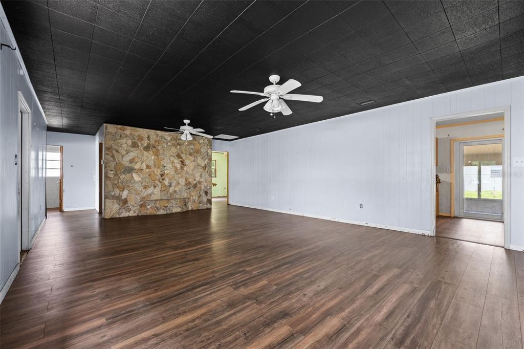 330 West 4th Street Frostproof, FL 33843 - Photo 6 of 39 wooden floor in an empty room with a window