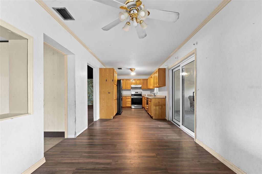 330 West 4th Street Frostproof, FL 33843 - Photo 7 of 39 a view of a hallway with wooden floor