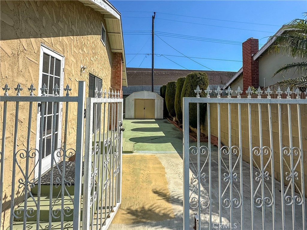 1702 East Bach Street Carson, CA 90745 - Photo 14 of 48 a view of a pathway of a building