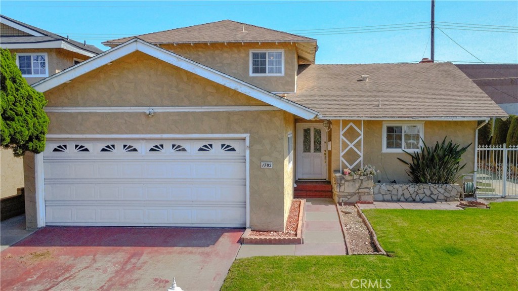 1702 East Bach Street Carson, CA 90745 - Photo 2 of 48 a front view of house with yard