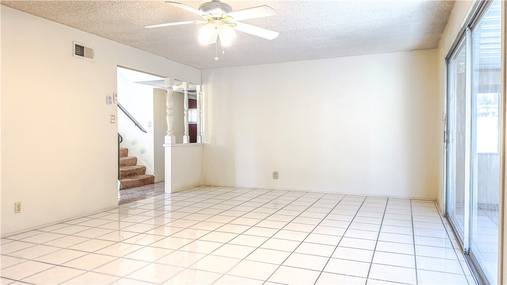 1702 East Bach Street Carson, CA 90745 - Photo 21 of 48 a view of an empty room with wooden floor and chandelier