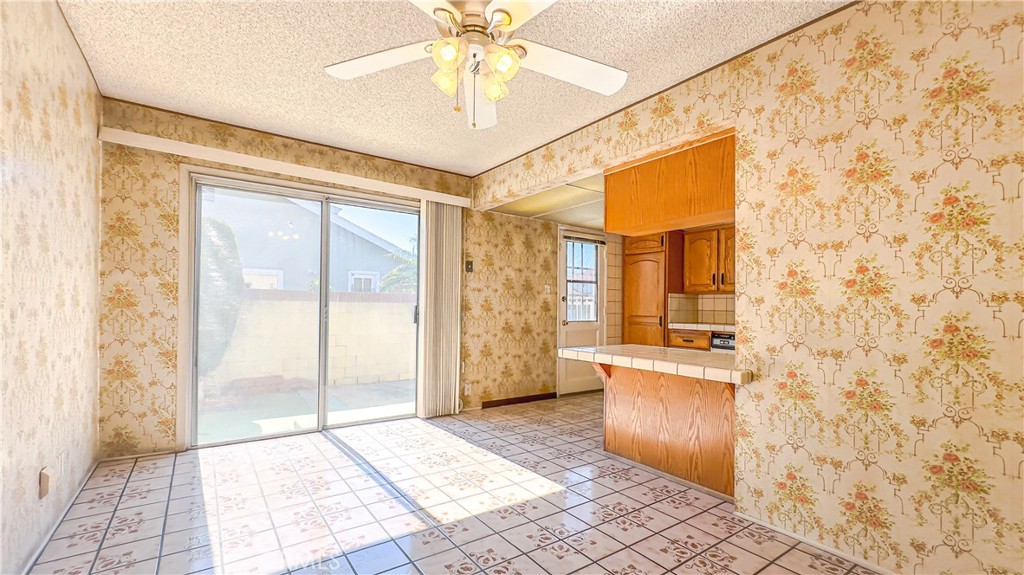 1702 East Bach Street Carson, CA 90745 - Photo 32 of 48 a bathroom with a granite countertop sink a large mirror and a shower
