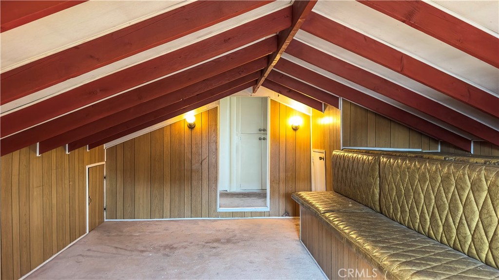 1702 East Bach Street Carson, CA 90745 - Photo 45 of 48 a view of a house with a balcony wooden fence