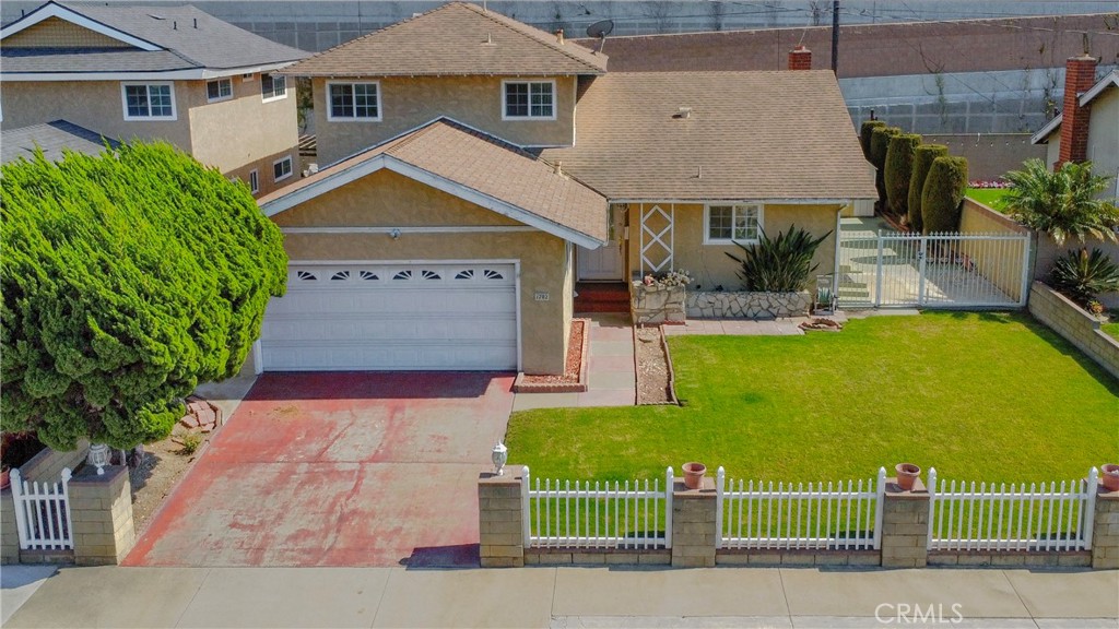 1702 East Bach Street Carson, CA 90745 - Photo 5 of 48 a front view of a house with garden