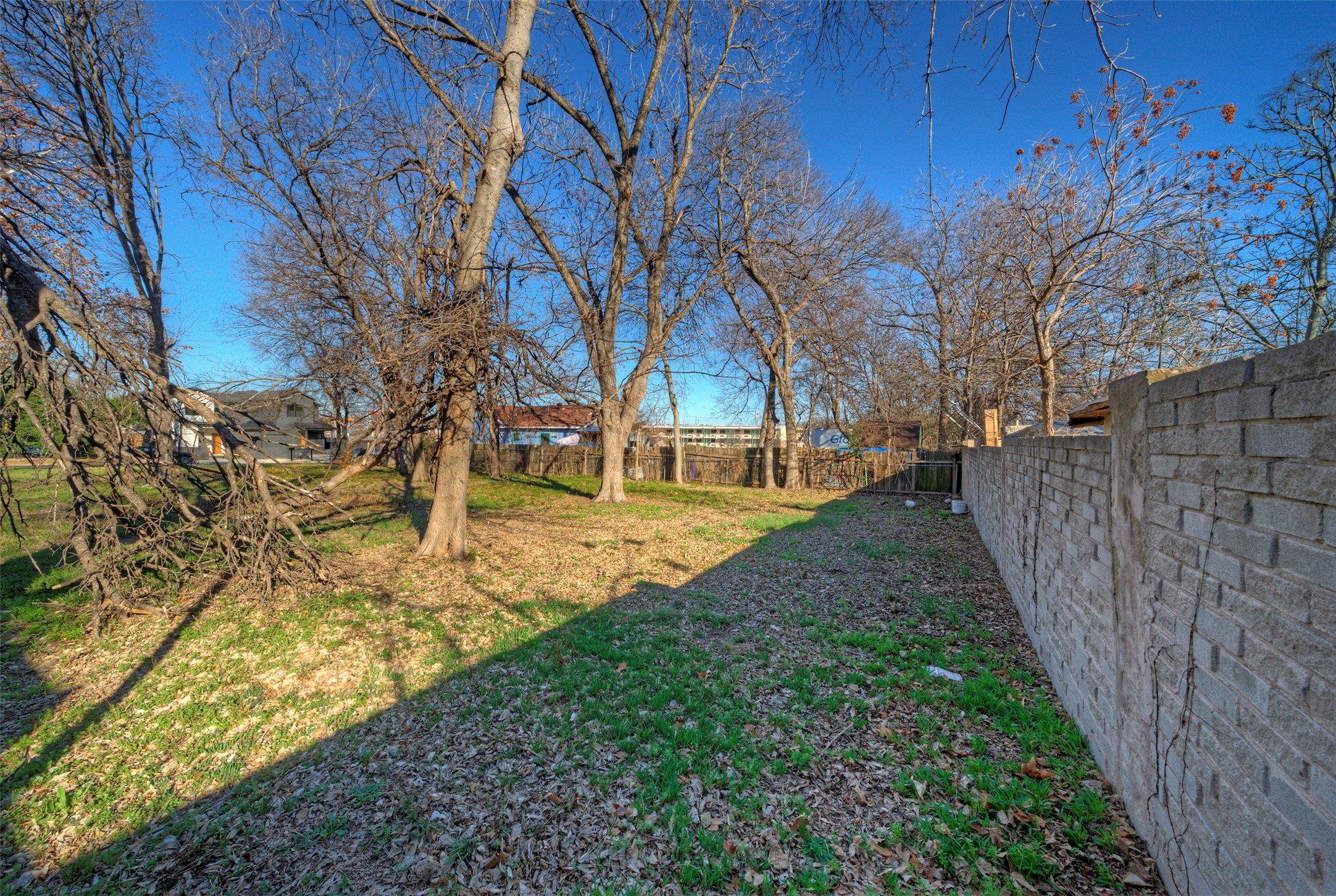 411 Hackberry Lane Austin, TX 78753 - Photo 11 of 18 a view of a yard with wooden fence