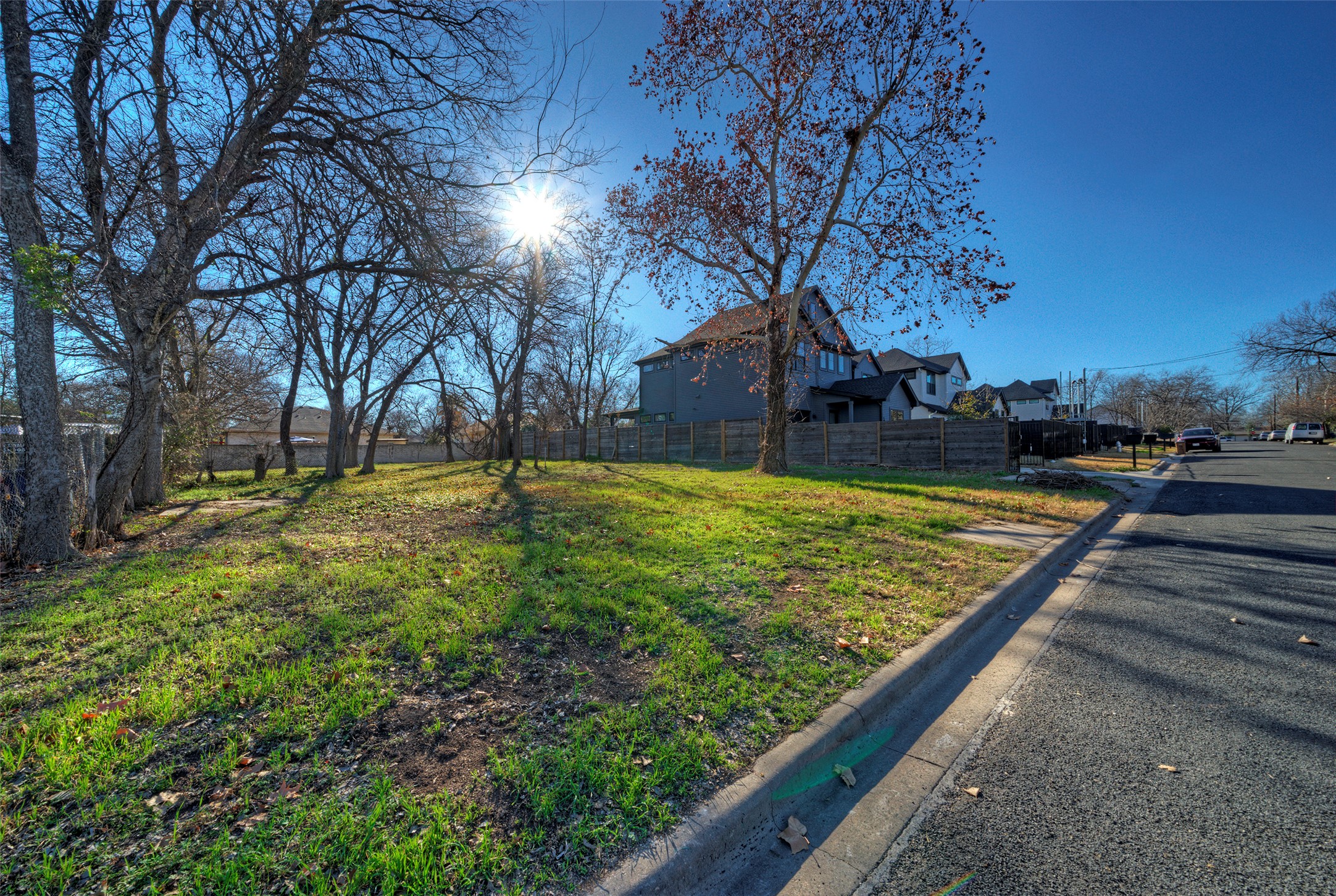 411 Hackberry Lane Austin, TX 78753 - Photo 7 of 18 a view of a yard with a house in the background
