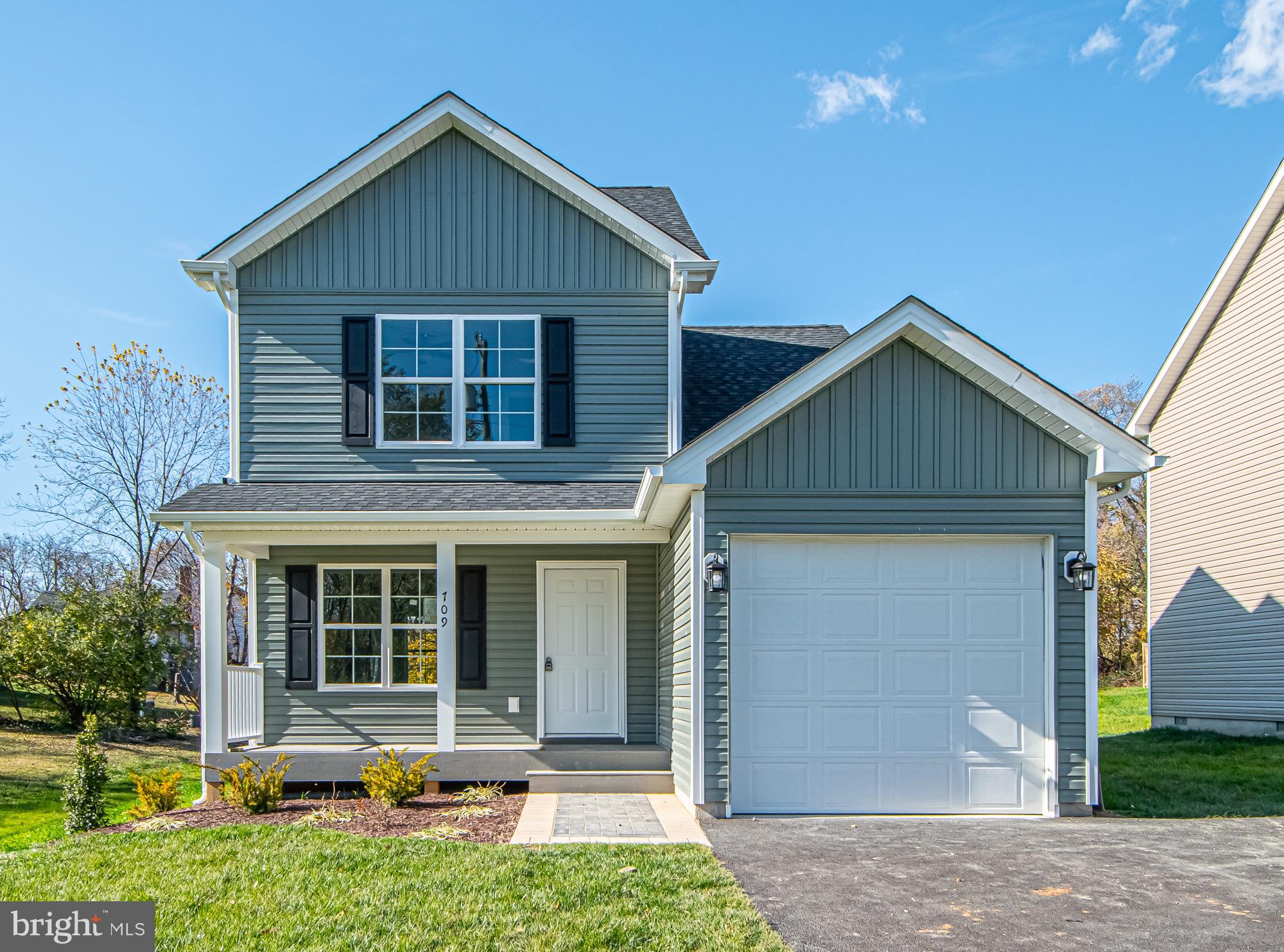 709 Ross Street Winchester, VA 22601 - Photo 1 of 40 a front view of a house with yard outdoor seating and garage