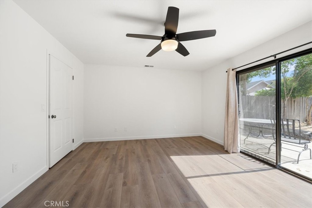 836 Casals Drive Paso Robles, CA 93446 - Photo 16 of 33 a view of empty room with wooden floor and fan