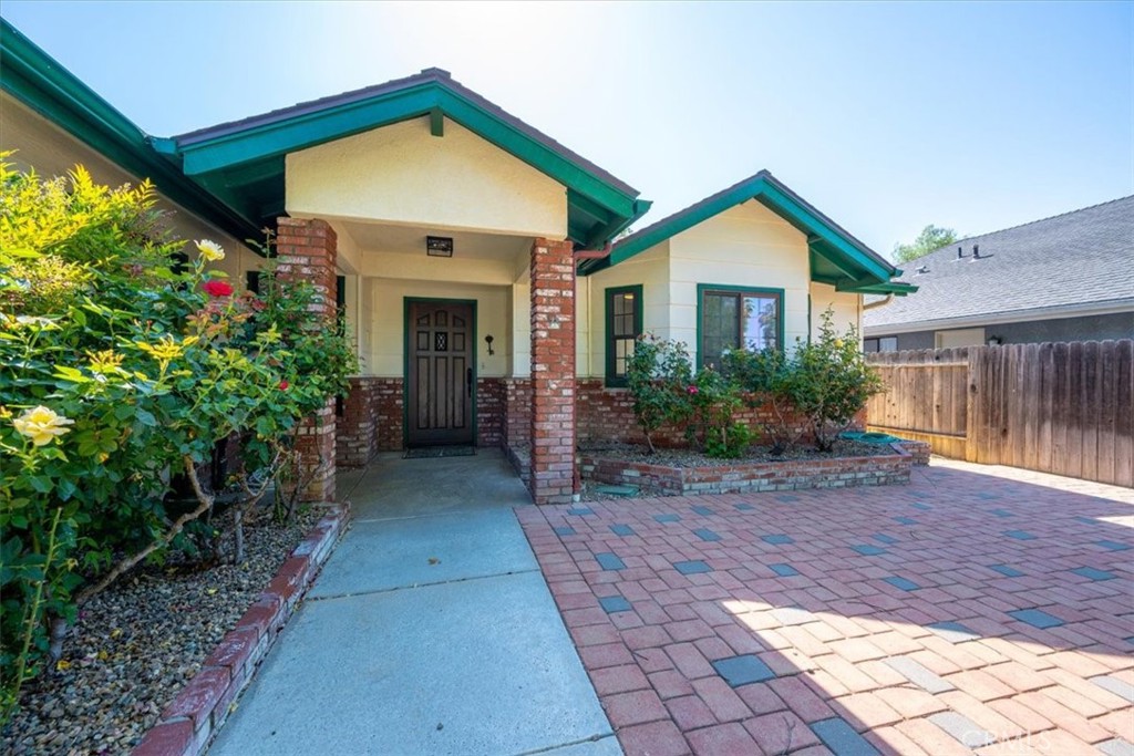 836 Casals Drive Paso Robles, CA 93446 - Photo 4 of 33 a front view of a house with garden