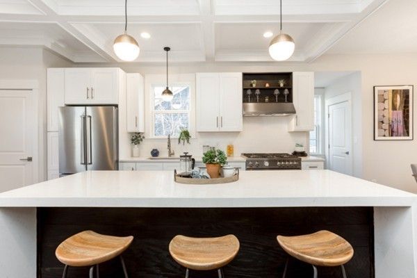 a kitchen with a table and chairs in it