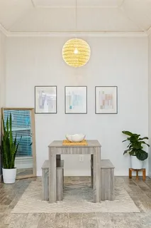 a workspace with furniture and a potted plant