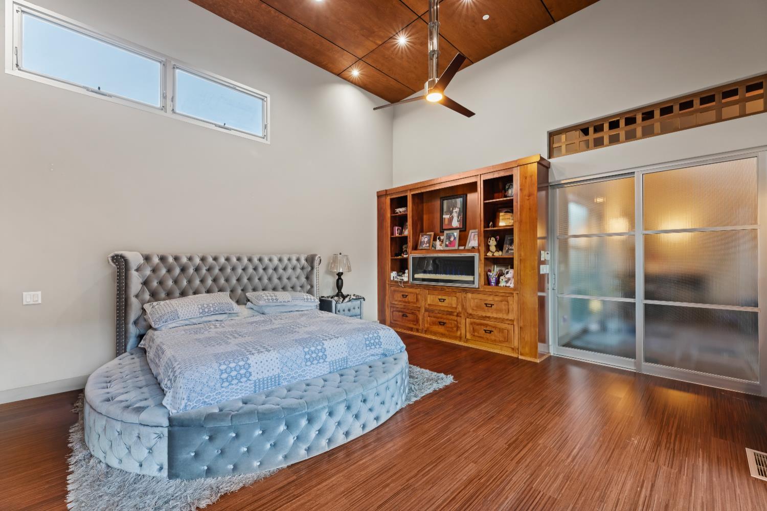 7434 River Nine Drive Modesto, CA 95356 - Photo 14 of 56 a room with a bed and a flat screen tv