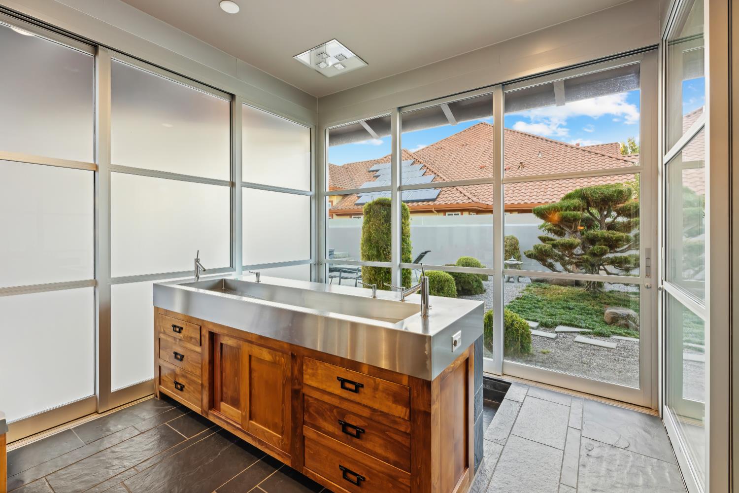 7434 River Nine Drive Modesto, CA 95356 - Photo 16 of 56 a view of a kitchen with a sink and windows