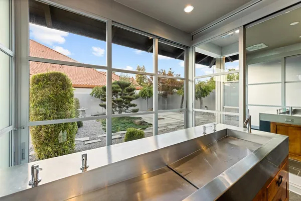 a view of a roof deck with couches and wooden floor