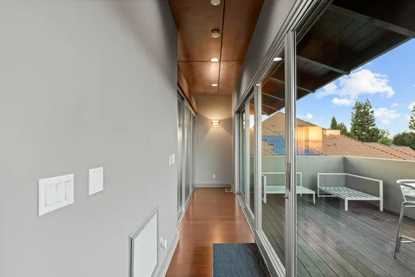 a balcony with wooden floor