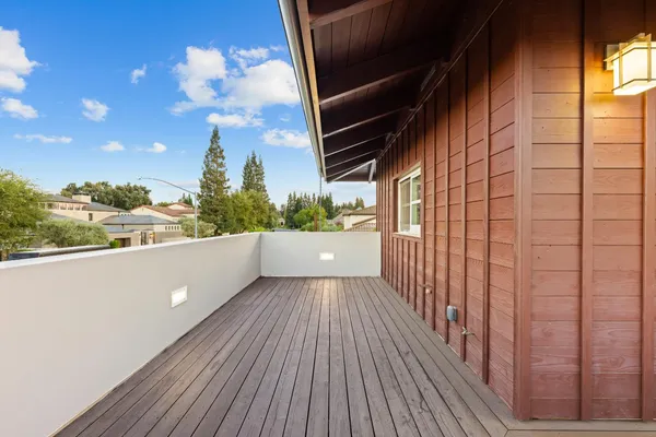 a living room with a table and a fireplace