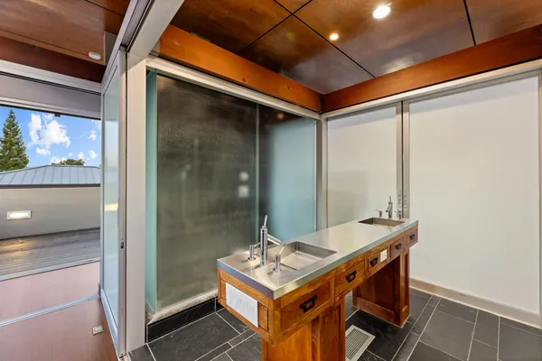 a lobby with furniture and a flat screen tv