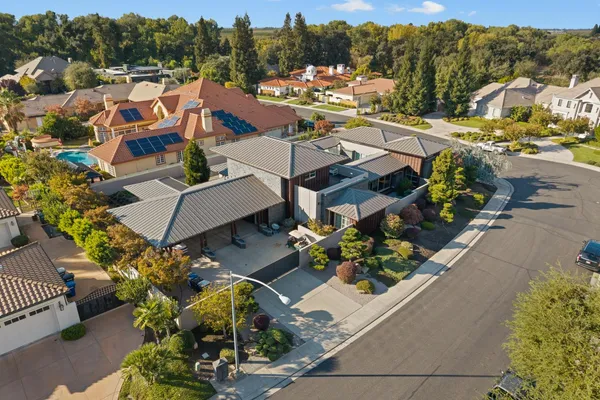 a view of a house with a garden and balcony