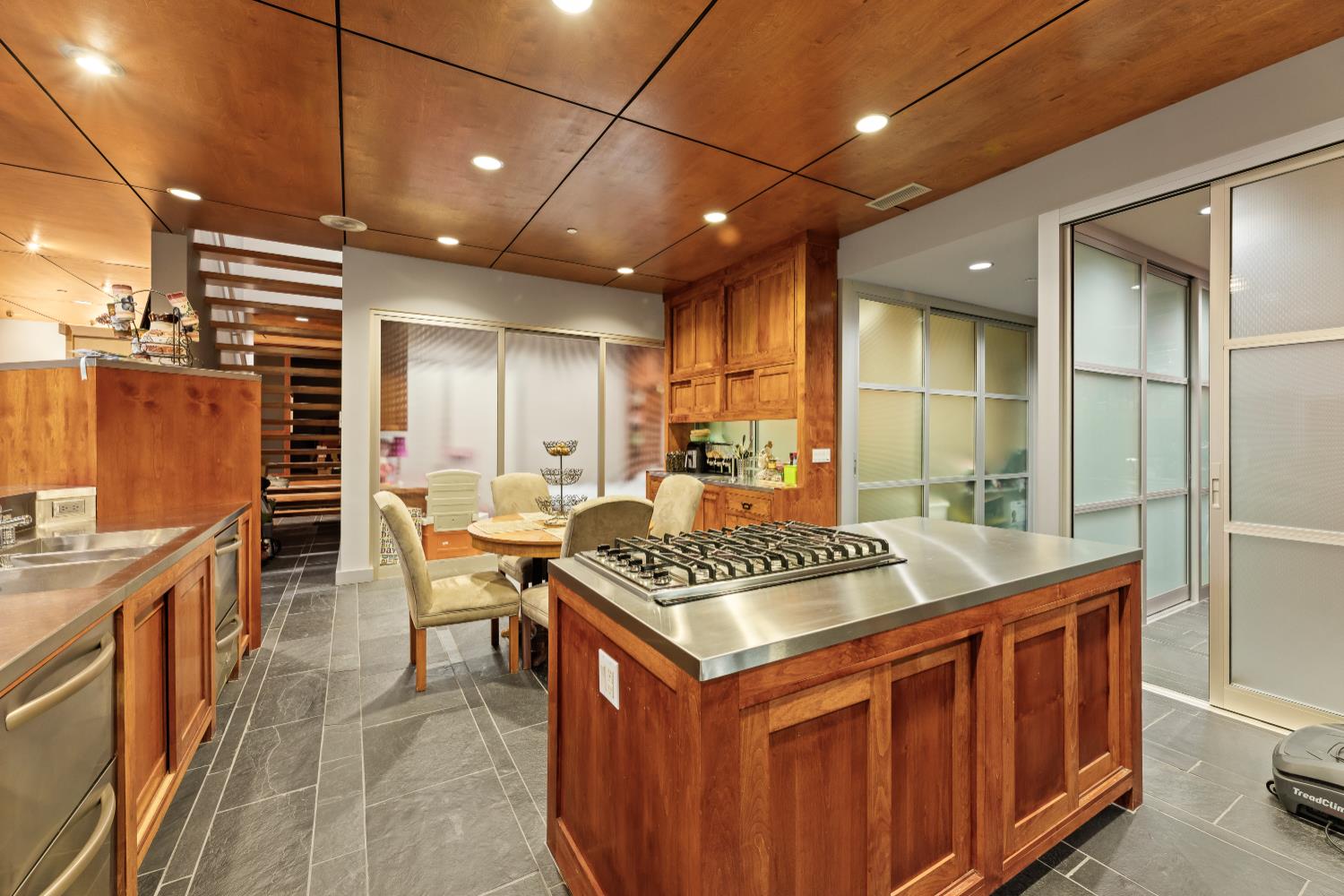7434 River Nine Drive Modesto, CA 95356 - Photo 37 of 56 a kitchen that has a lot of cabinets in it and wooden cabinets